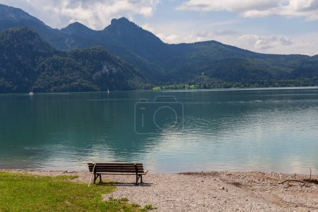 Mountain alps panorama with bench at lake Kochelsee in Bavaria, Germany