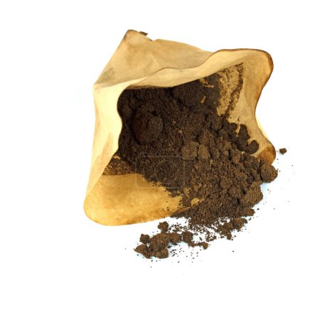 Filter bag with coffee grounds against a white background