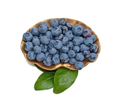Blueberries on a bowl against white background