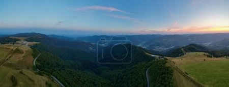 Photo for Dive into a breathtaking 180 landscape extending from Markstein to Trehkopf, nestled in the heart of the majestic Vosges Mountains of Alsace. This exceptional panorama captures the ever-changing hues of nature, as dawn's first light kisses the hills. - Royalty Free Image