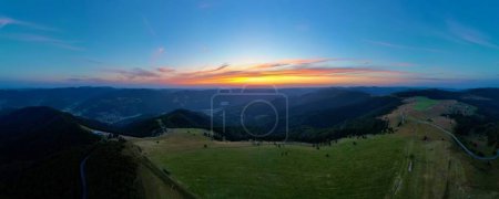 Photo for Dive into a breathtaking 180 landscape extending from Markstein to Trehkopf, nestled in the heart of the majestic Vosges Mountains of Alsace. This exceptional panorama captures the ever-changing hues of nature, as dawn's first light kisses the hills. - Royalty Free Image