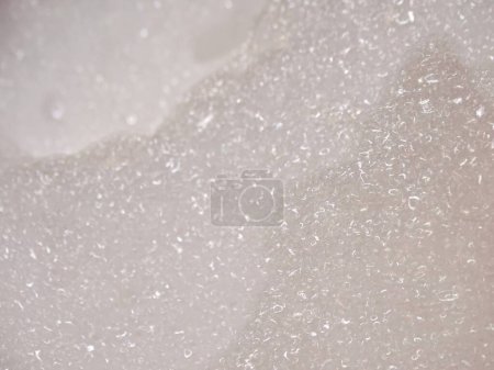 Photo for Close-Up of Dense White Foam Covering the Entire Bath - Royalty Free Image