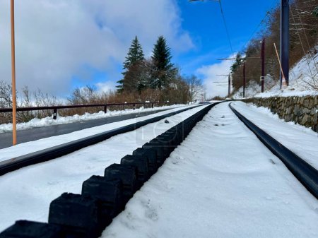 Snowy Journey: Rack Railway Tracks Ascending Puy de Dome, Embracing Winter's Beauty