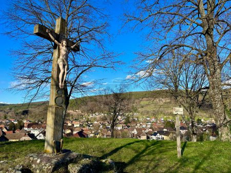 Sacred Silhouette: The Mission Cross of Kuppel Overlooking the Quiet Town of Buhl, Alsace