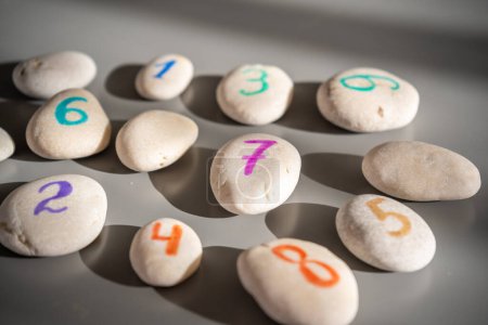 Colorful stones signed by numbers, an alternative method of children education. Number 7 in center. High quality photo