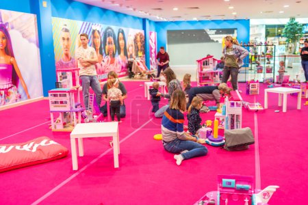 Photo for Prague, Czech Republic - April 27, 2023: Children playing in childrens playroom with Barbie toys and Hot Wheels in the Letnany shopping center in Prague, Czech Republic. High quality photo - Royalty Free Image