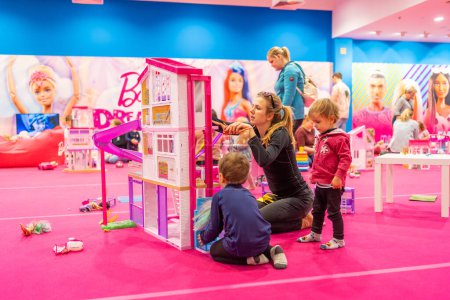 Photo for Prague, Czech Republic - April 27, 2023: Children playing in childrens playroom with Barbie toys and Hot Wheels in the Letnany shopping center in Prague, Czech Republic. High quality photo - Royalty Free Image