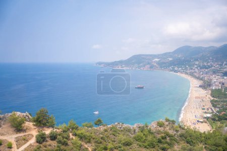 Aerial view of Cleopatra beach from mountain on blue sea background in Alanya, Turkey. High quality photo