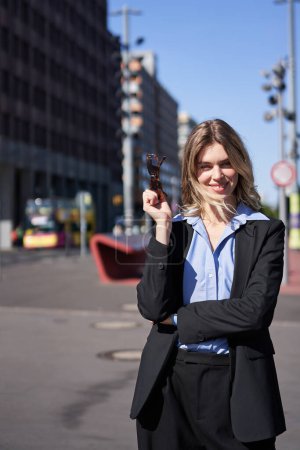 Photo for Vertical portrait of successful woman on street. Businesswoman in suit looking confident. - Royalty Free Image