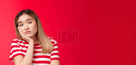 Photo for Close-up tired girl express apathy boredom, sighing reluctant look camera lean face palm falling asleep, feel boring listening uninteresting lecture, stand red background displeassed. - Royalty Free Image