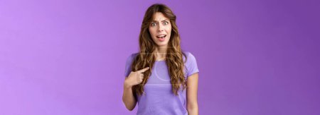 Photo for Accused frustrated upset shocked girl ambushed strange choice accusations pointing herself offended complaining frowning stand questioned displeased unfair decision purple background. - Royalty Free Image