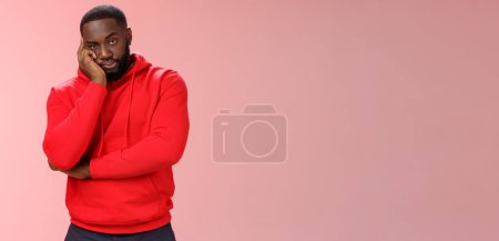 Photo for Bored annoyed african-american guy look sceptical dying boredom cannot wait go home lean head palm raise eyebrow judgemental ignorant, standing bothered irritated pink background. - Royalty Free Image