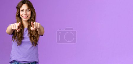Photo for We need you join our team. Assertifed confident good-looking female office manager hr recruiting new people searching newbies smiling self-assured pointing fingers camera purple background. - Royalty Free Image