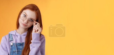 Photo for Annoyed bossy unimpressed bothered young redhead female coworker smirking tilting head irritated touch glasses look ignorant cringing stupid uninteresting doubtful story not buy any excuses. - Royalty Free Image