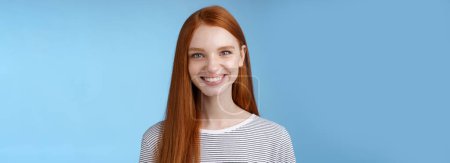 Photo for Pleasant reliable sincere good-looking redhead female freelancer college student make confident professional impression smiling broadly assertive helpful standing blue background self-assured. - Royalty Free Image