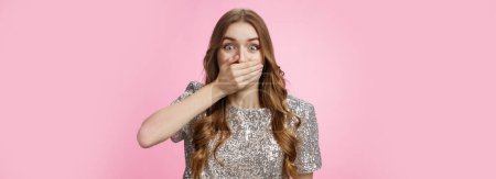 Photo for Amused entertained girl having fun cannot hold laugh cover mouth pressed palm not chuckle out loud widen eyes surprised joyful, mocking pranking friend having fun standing pink background. - Royalty Free Image