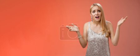 Photo for Why leaving early. Upset complaining young attracitve bothered blond woman complaining look questioned disappointed raise hands up sideways dismay clueless frowning displeased, red background. - Royalty Free Image