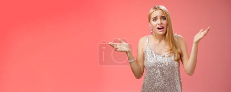 Photo for Why leaving early. Upset complaining young attracitve bothered blond woman complaining look questioned disappointed raise hands up sideways dismay clueless frowning displeased, red background. - Royalty Free Image