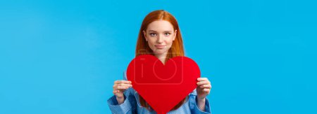 Photo for . Showing my affection. Valentines day concept. Confident and bold cute redhead woman in nightwear holding huge heart gesture and smiling, expressing love and admiration, confessing. - Royalty Free Image