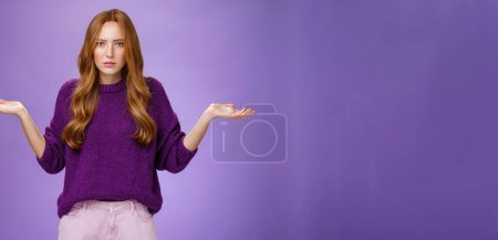 Photo for What your problem. Frustrated, confused and annoyed redhead girlfriend arguing cannot get clue why bother shrugging with raised hadns aside and puzzled expression, irritated with stupid quarrel. - Royalty Free Image
