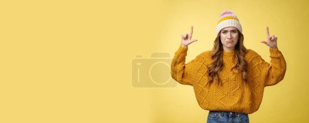 Photo for Upset whining complaining displeased cute young immature girl raise hands pointing up crying jealous regret wanna buy cool product have no money, standing sad sobbing yellow background. - Royalty Free Image