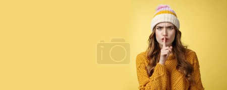 Photo for Furious angry annoyed cute woman shushing you irritated loud talk during important meeting frowning cringing pissed showing shhh gesture index finger pressed mouth, yellow background. - Royalty Free Image