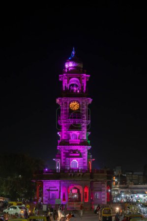 Photo for Jodhpur, Rajasthan, India - 18.10.2019 : Popular Sardar Market and Ghanta ghar, Clock tower in evening at Jodhpur, Rajasthan, India. Vertical image. - Royalty Free Image