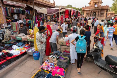 Photo for Jodhpur, Rajasthan, India - 20.10.2019 : Rajasthani buyers and sellers at famous Sardar Market and Ghanta ghar Clock tower in Jodhpur, Rajasthan, India. - Royalty Free Image