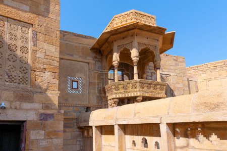 Photo for Sandstone made beautiful balcony, jharokha, stone window and exterior of Rani Mahal or Rani Ka Mahal, inside Jaisalmer fort. Rajasthan, India. UNESCO World heritage site. - Royalty Free Image