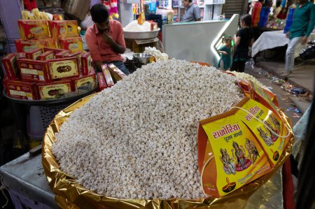 Photo for Jodhpur, Rajasthan, India - 20.10.2019 : Popcorn is being sold in street at famous Sardar Market and Ghanta ghar Clock tower in Jodhpur, Rajasthan, India. - Royalty Free Image