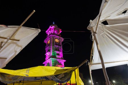 Photo for Jodhpur, Rajasthan, India - 18.10.2019 : Famous Sardar Market and Ghanta ghar Clock tower at night in Jodhpur, Rajasthan, India. Market place in foreground. - Royalty Free Image