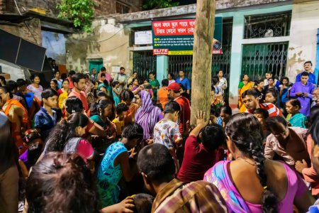 Photo for Howrah, West Bengal, India - 15th April 2019 : Hindu devotees praying to Holy wood - during Gajan and Charak Puja - a Hindu festival. Lord Shiva, Neel and Dharmathakur are worshipped. - Royalty Free Image