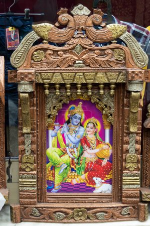 Photo for Jodhpur, Rajasthan, India - 19.10.2019 : Beautiful framed art of Radha and Krishna, Hindu God, displayed for sale at famous Sardar Market and Ghanta ghar Clock tower in Jodhpur, Rajasthan, India. - Royalty Free Image