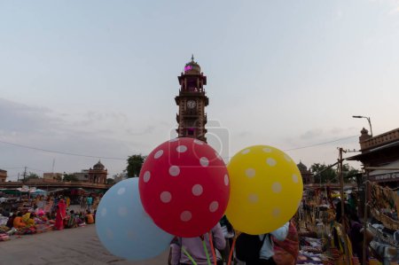 Photo for Jodhpur, Rajasthan, India - 20.10.2019 : Balloons being sold at famous Sardar Market and Ghanta ghar Clock tower in Jodhpur, Rajasthan, India. - Royalty Free Image