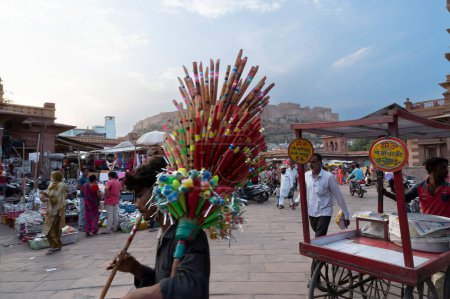 Photo for Jodhpur, Rajasthan, India - 20.10.2019 : Flutes are being sold at famous Sardar Market and Ghanta ghar Clock tower in Jodhpur, Rajasthan, India. - Royalty Free Image