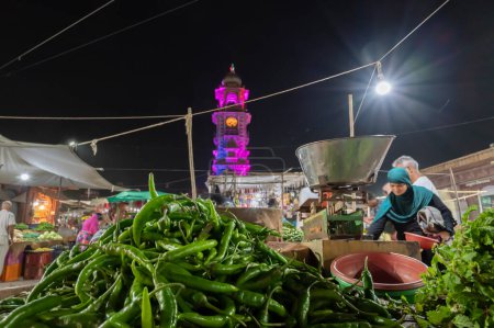 Photo for Jodhpur, Rajasthan, India - 18.10.2019 : Green chillies being sold at famous Sardar Market and Ghanta ghar Clock tower in Jodhpur, Rajasthan, India. - Royalty Free Image