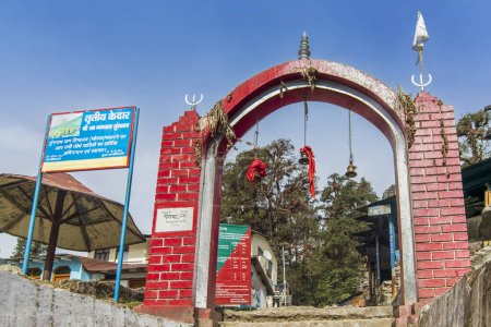 Photo for Chopta, Uttarakhand, India - 1st November 2018 : Red gateway for trekkers for Tungnath trek route, one of the highest Shiva temples in the world and it is the highest of the five Panch Kedar temples. - Royalty Free Image
