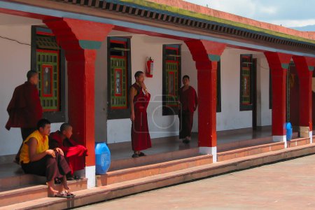 Photo for Gangtok, Sikkim, India - 9th May 2008 : Monks relaxing after prayer at Rumtek Monastery, Dharma Chakra Centre, is a gompa and seat-in-exile of the Gyalwang Karmapa, Sikkim, India. - Royalty Free Image