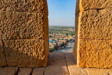 Photo for Jaisalmer,Rajasthan,India - October 15, 2019 : Jaisalmer Fort or Sonar Quila or Golden Fort, made of yellow sandstone, in the morning light. UNESCO world heritage site at Thar desert. - Royalty Free Image