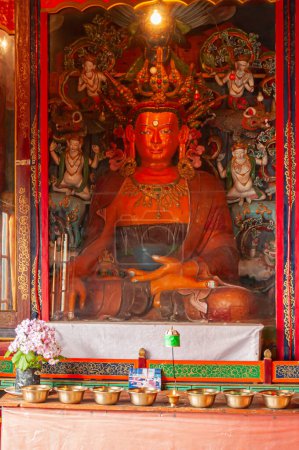 Photo for Sikkim, India - 22nd March 2004 : Glass covered colorful Buddist Gods and Godesses, often depicting earlier births of God Buddha, inside Buddhist Andhen or Andey monastery. - Royalty Free Image