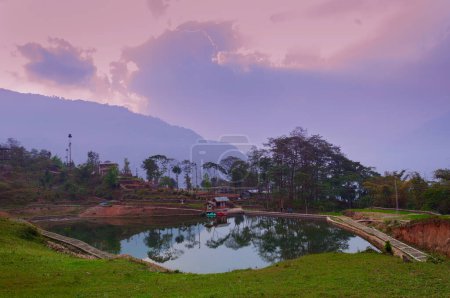 Photo for Sunset sky over Chayatal or Chaya Taal, West Sikkim, India, Nature, silence and peace. Famous for Reflection of snow-capped Mount Kanchenjunga and Kabru on lake water, Himalayan mountains. - Royalty Free Image
