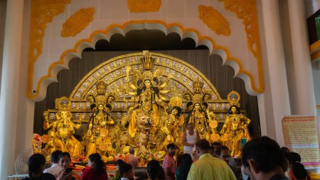 Photo for Howrah, West Bengal, India- 4th October, 2022 : Decorated Durga idol is being worshipped inside illuminated puja pandal. Mandirtala sadharon durgotsab. Durga Puja is biggest festival of Hinduism. - Royalty Free Image