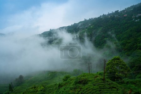 Monsoon clouds passing over Himalayan mountains of Darjeeling, West Bengal, India. Darjeeling is queen of hills and very scenic with beautiful green hills in rainy season.