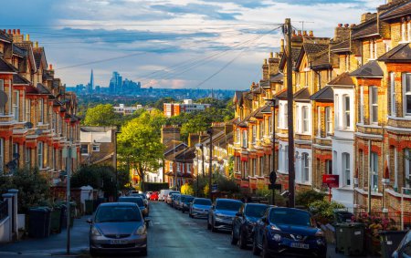 Photo for Crystal Palace, London, United Kingdom - August 26, 2023: Skyline view of traditional English houses from Sydenham Hill towards the city of London on a sunny day - Royalty Free Image