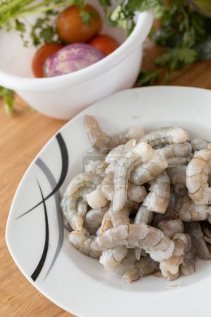 Photo for Healthy food ingredient, detail of peeled shrimp, shells, vegetables, seafood restaurant, dish preparation, menu wallpaper - Royalty Free Image