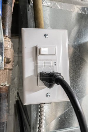 Photo for New GFCI electrical outlet has been installed during a funrnace repair - Royalty Free Image