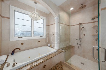 Photo for Custom bathroom renovation has new ceramic tiles and fixtures installed - Royalty Free Image