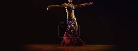 Photo for The girl performs a belly dance, the culture of the ancient east - Royalty Free Image