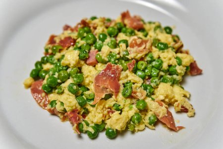 Photo for Peas and ham scrambled eggs meal. Selective focus. - Royalty Free Image