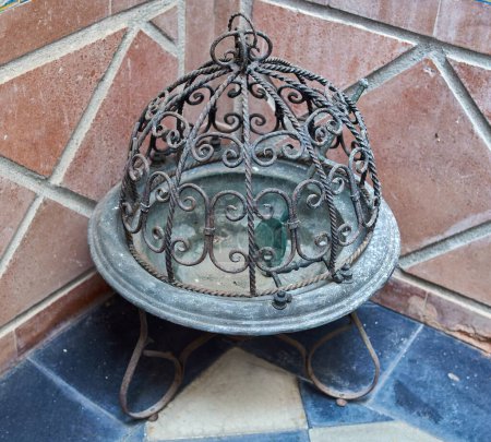 Antique charcoal brazier, made of bronze. Selective focus.